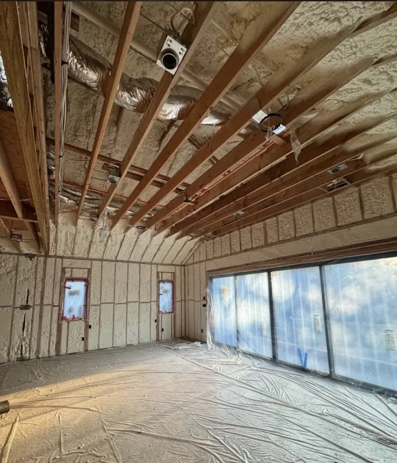 Interior walls and ceiling insulated with spray foam during new construction in Milledgeville